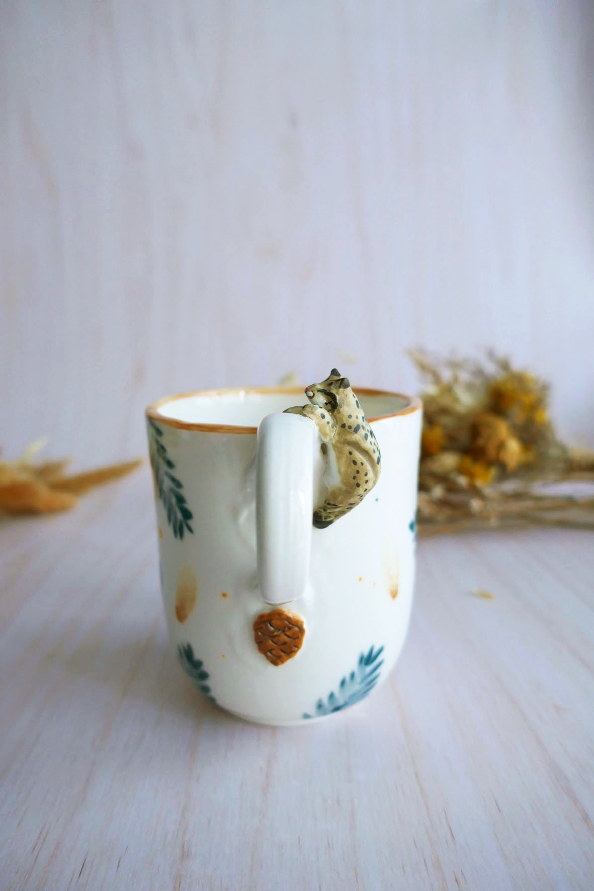 Mug à anse en porcelaine "Lynx aux sapins"